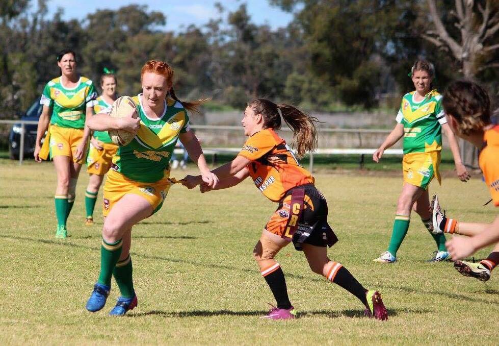 DEFENCE: Samantha Doran tags a player from Boggabri in the Uralla Tigers ladies league tag's 30 points to nil win on Saturday.