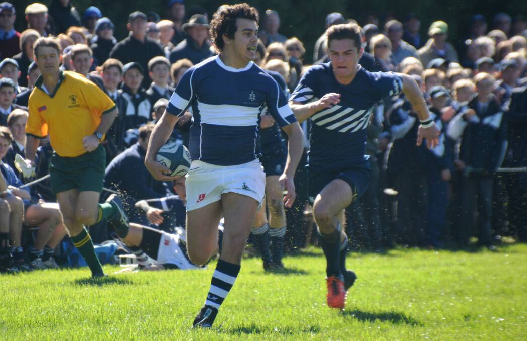ON A RUN: Samuel Jackson-Bolton finds himself in open space in TAS' match against Shore School on Saturday. TAS punished the visitors by scoring 41 unanswered points.