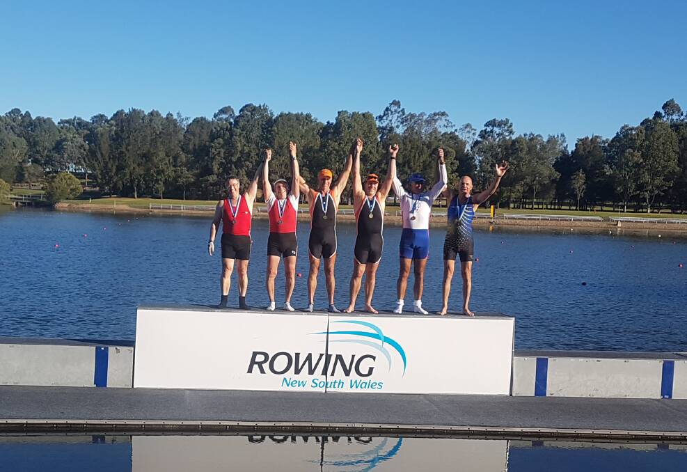 PODIUM FINISH: Tim Rogers and John Grant, pictured in the centre, won gold in the Men's Masters F at the Sydney International Regatta Centre last week. 