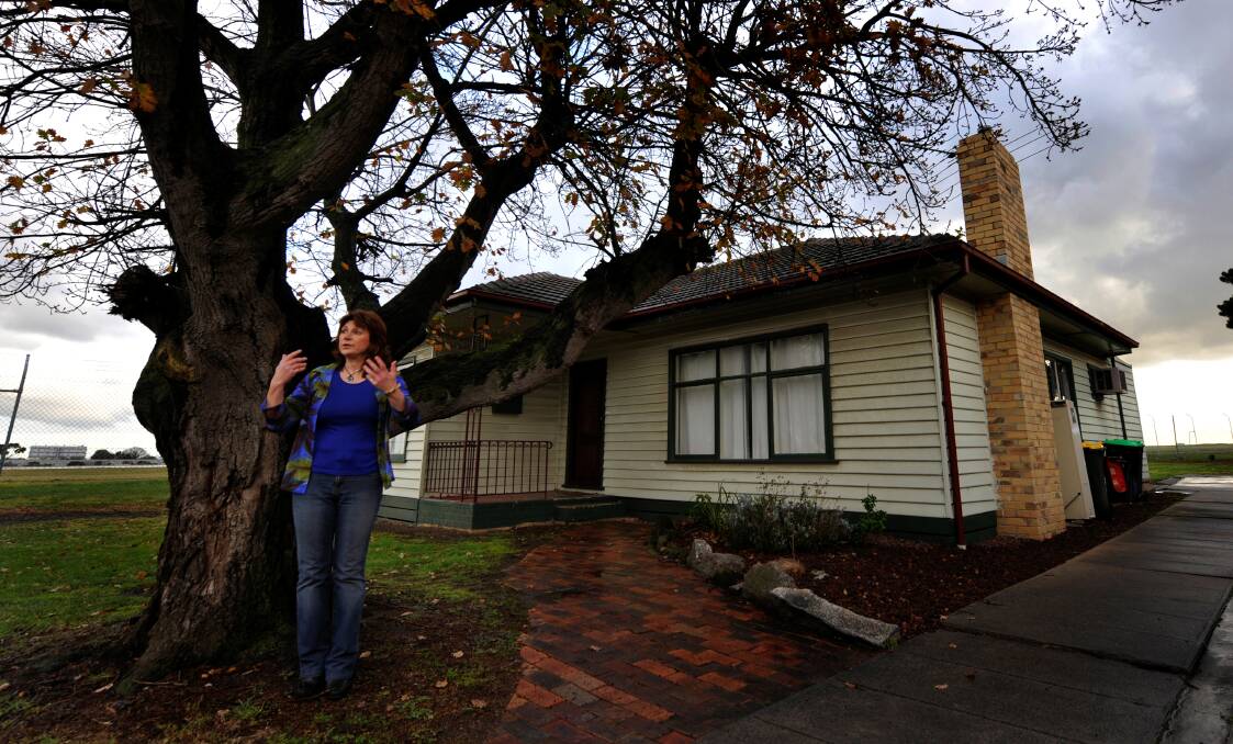 Corowa bound: Home owner Vicki Cosentino and her house from the movie The Castle which is set to be relocated to the Border. 