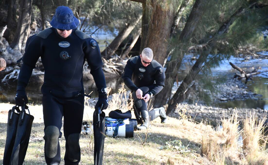 Major search: Police divers at Eaglehawk Reserve near Bingara in June. Photo: Aidan Wondracz
