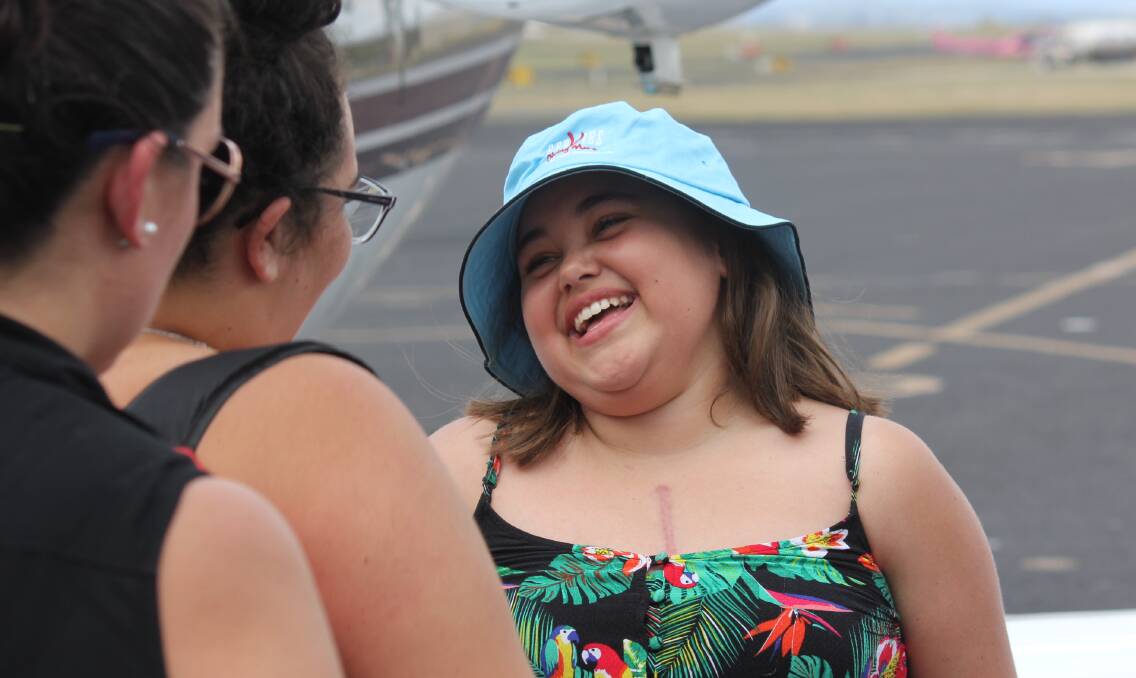 TOUCH DOWN: Hannah Whitton was all smiles on Thursday when she arrived at Armidale Regional Airport by private jet after months in hospital.