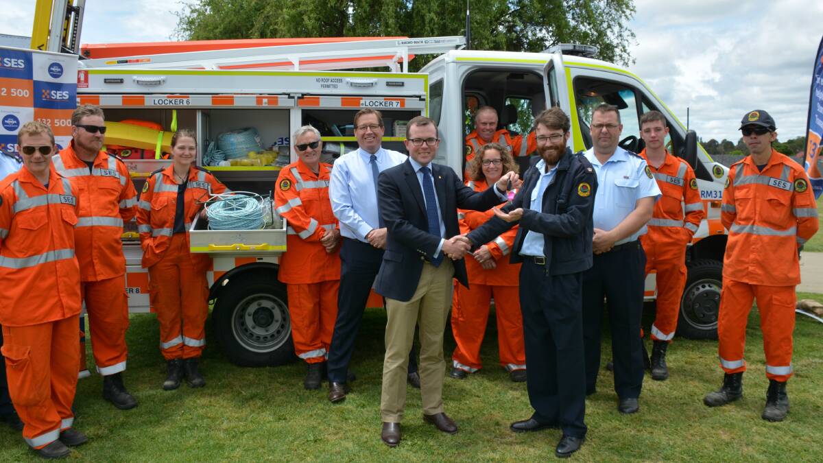 BETTER EQUIPPED: Northern Tablelands MP Adam Marshall presents Armidale SES controller Josh Osborne with the keys to a new response vehicle.
