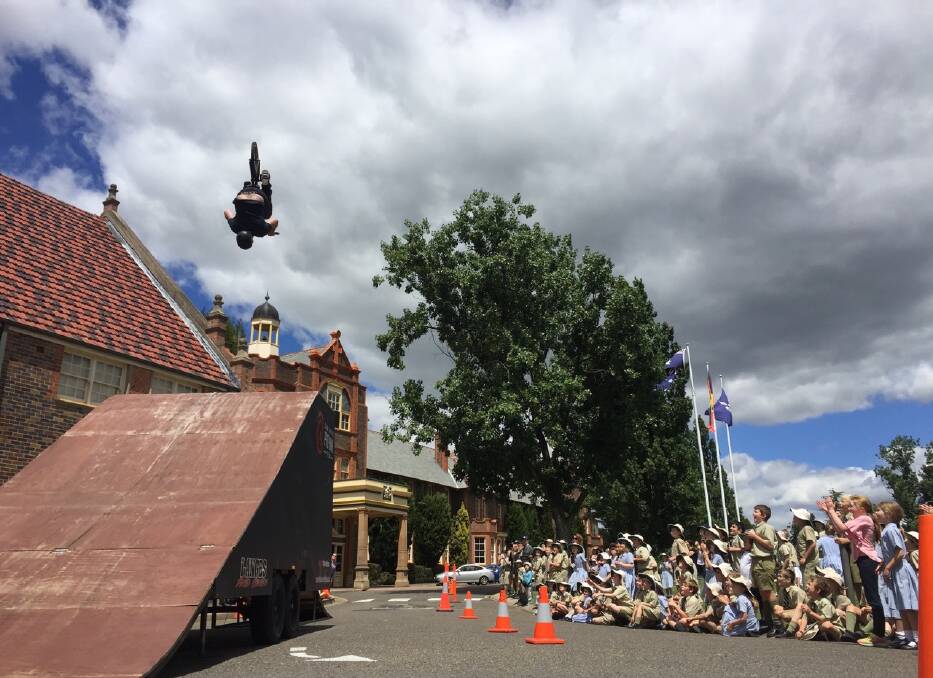 FLIP OUT: BMX riding champion Cam White shows off his tricks at The Armidale School  before giving a speech to junior school students as part of the annual Speech Day.
