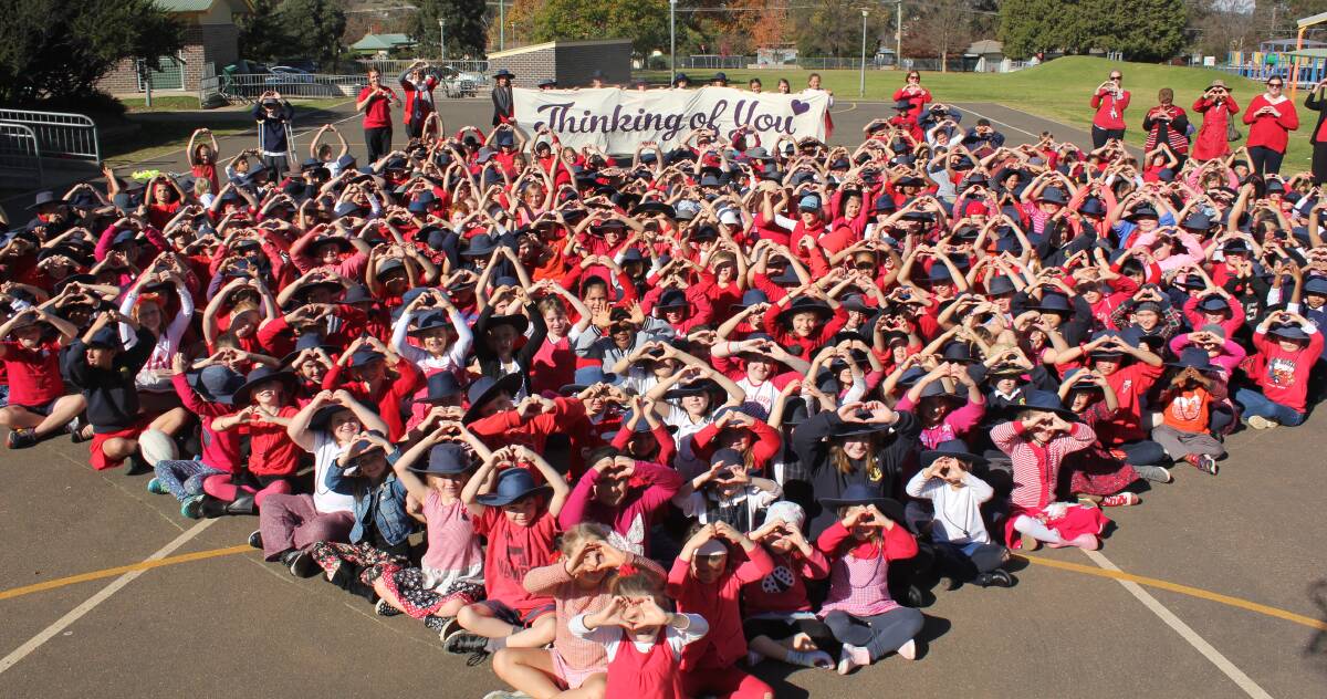 THINKING OF YOU: Ben Venue Public School students show their support for fellow classmate Hannah Whitton who will need a heart transplant. 