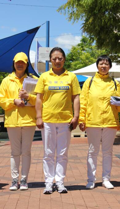 Falun Gong practitioners with Lichen Zhang (centre) protested live organ harvesting in the Beardy Street Mall.