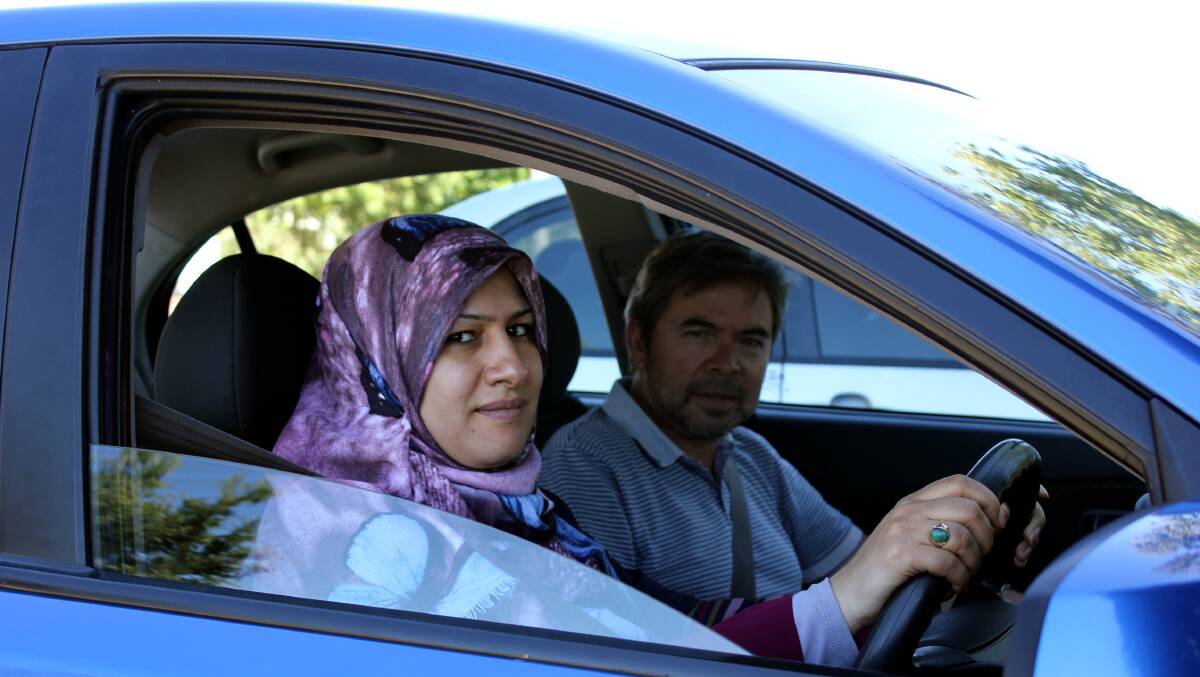 HIT THE ROAD: International Hub project officer Dunya Alruhaimi learns to drive in Armidale with Aussie Blue instructor Dimitrios Callias.
