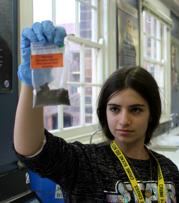 CRIME SCENE INVESTIGATION: Year 8 student Peta Gilbert is testing soil to see if it matches traces found at the crime scene she is investigating as part of the camp.