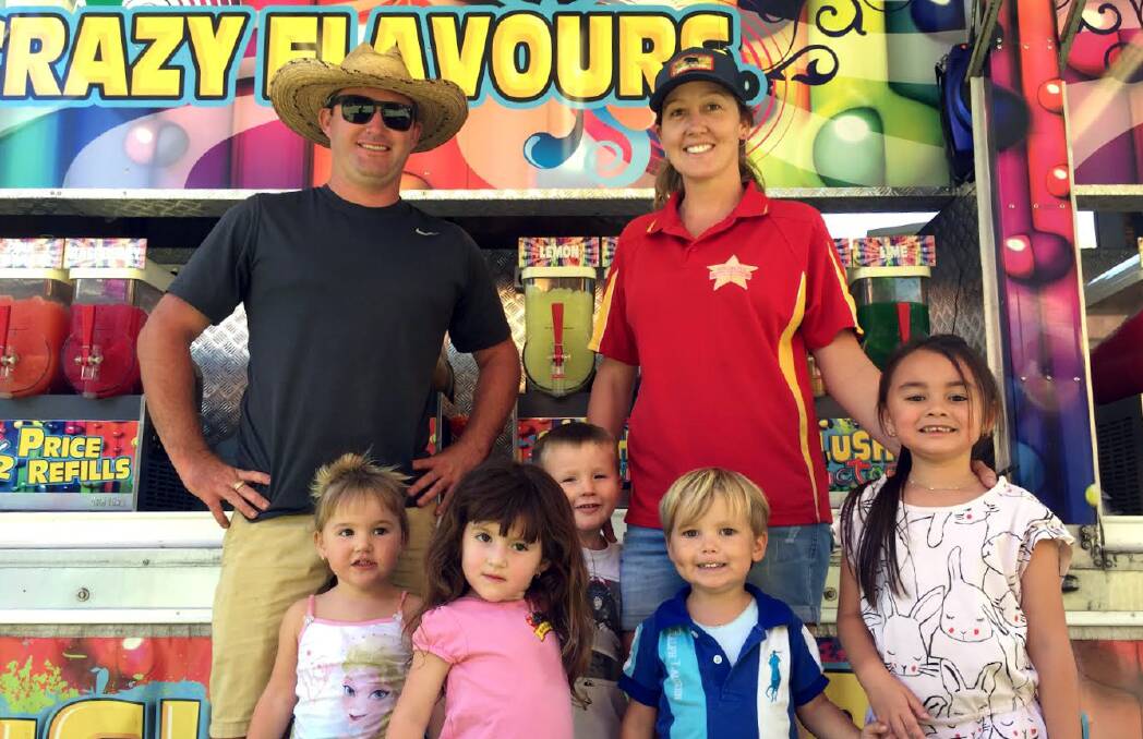 GUYRA SHOW: Carnival workers Elliot Brophy, Laney Pink and children from the community will travel thousands of kilometres to bring rides to shows across Australia.