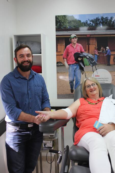 BLOOD DONATIONS: Foundations Care non-placement support services manager Demian Coates with brave coworker Sharon Ritchie donating blood with the Red Cross. The donations are organisation-wide.