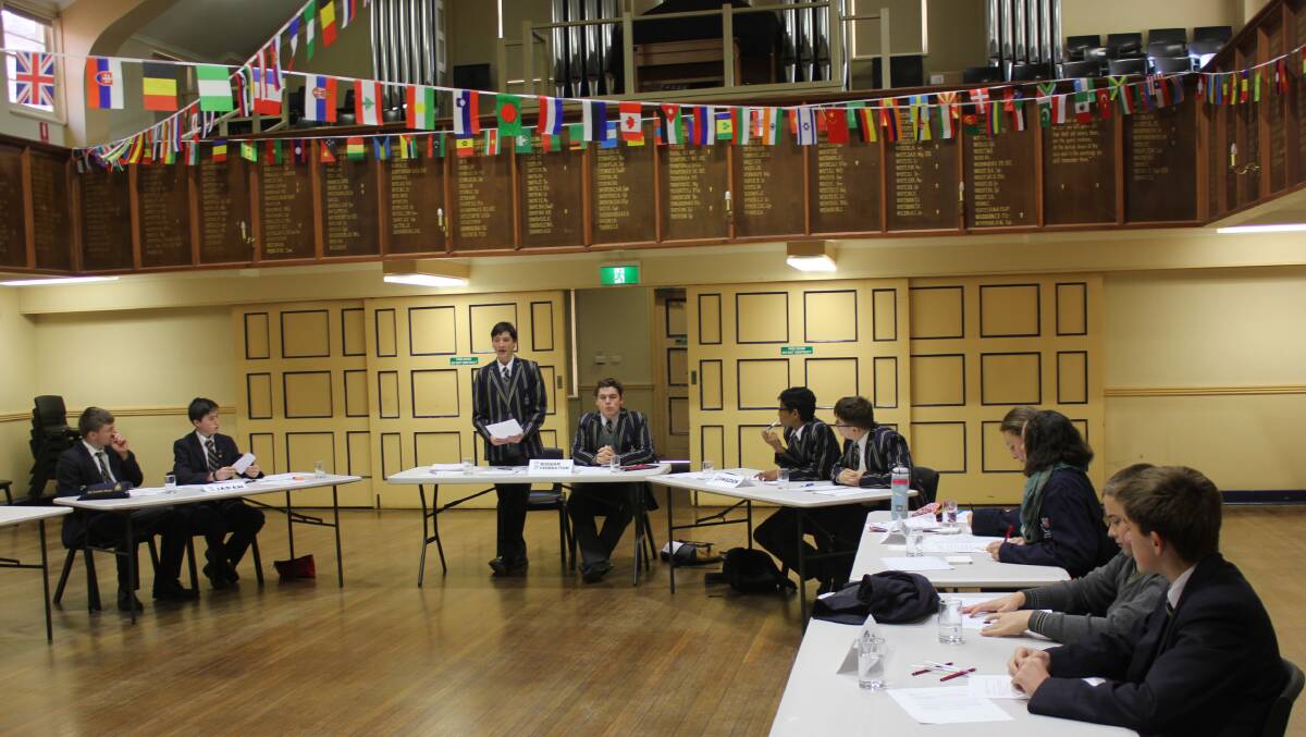 MODEL UN: Students from The Armidale School and Armidale High School represent nations from around the world in a model UN problem-solving simulation.