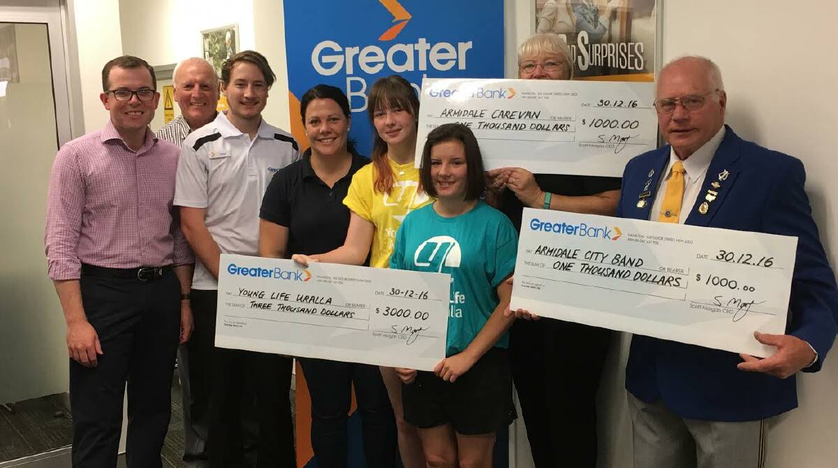 CASHED-UP: MP Adam Marshall with the recipients of the Greater Bank community grants. Young Life received the largest grant and the runners-up $1000.