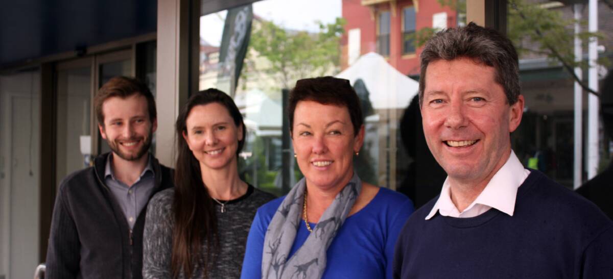From left: Lachlan Ritchie, Jacqui L'Hostis, Kay Endres and Craig Ritchie outside the premises for New England Travel. The store moves after 38 years at 188 Beardy Street.
