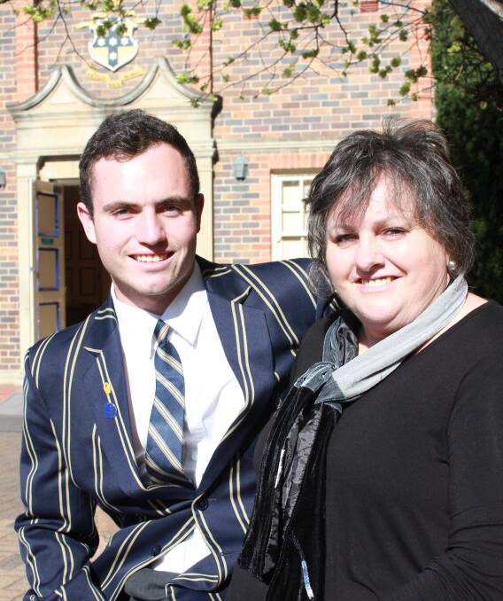 The Armidale School student Jacob Faint with his mother Jeannet Browne at the Year 12 graduation ceremony on Friday. Mr Faint is one of the school's longest attending students with 15 years at TAS under his belt.