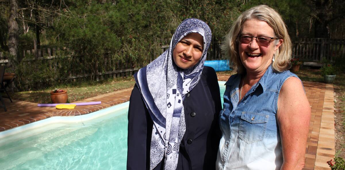 DIVE IN: Dunya Alruhaimi and Rosemary Glover have pioneered a program to teach Muslim women and their children in Armidale how to swim.