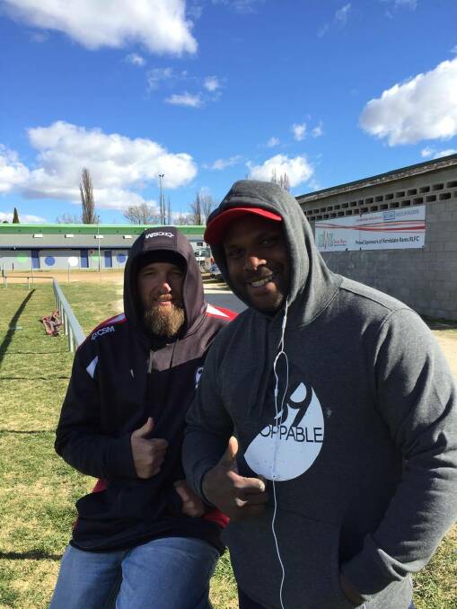 SPORTS FANS: Kevin Trotter and Don Kusu got out and about for a game of rugby on Saturday.