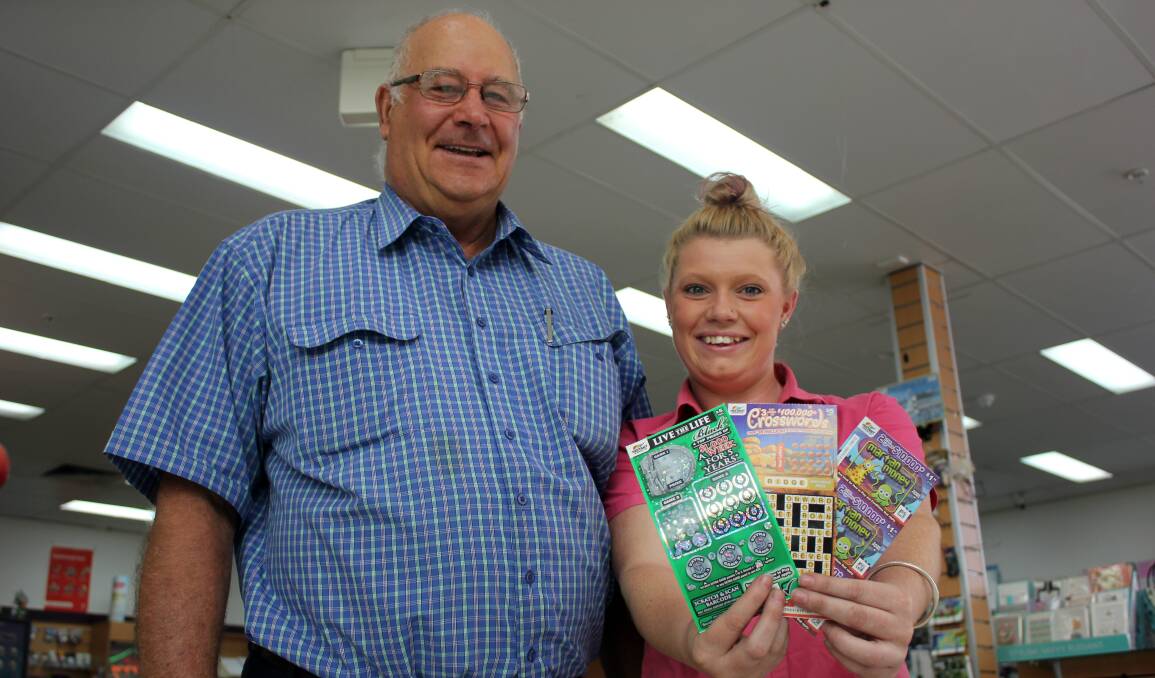 BIG WIN: Heagney's Plaza News owner Athol Heagney with colleague Tiffany Snowden at the store that sold the $10,000 winning scratchie to a stastistics student.