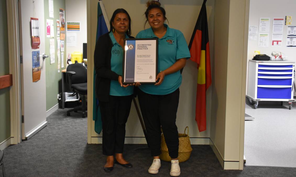 ARMAJUN ACCREDITATION: Deb Green, practice manager, and Kahlia Strong, Aboriginal health worker, holding the AGPAL accreditation.