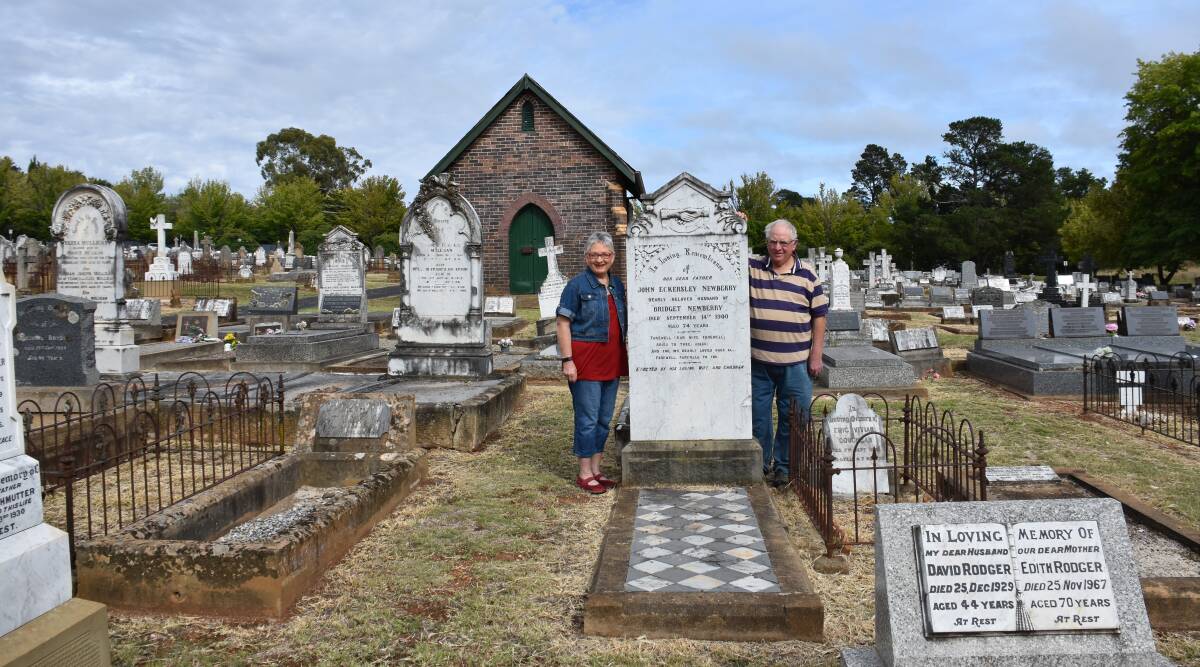 FAMILY HISTORY: Siblings Bruce Newberry and Penny Williams at their ancestor John Eckersley Newberry's grave, Armidale Cemetery.  (Photo: Nicholas Fuller.)