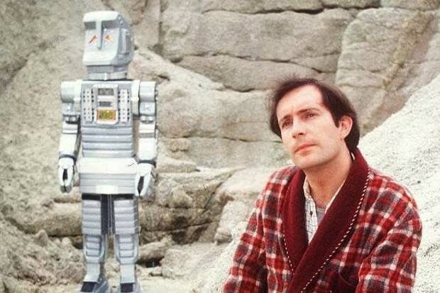 Bewildered Earthman Arthur Dent (Simon Jones) with Marvin the paranoid android, in the BBC's 1981 television series.