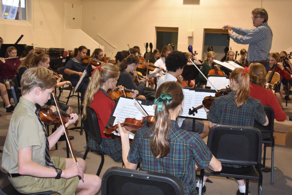 YOUNG MUSICIANS: Russell Bauer rehearsing the Armidale Youth Orchestras.  Photo: Nicholas Fuller.