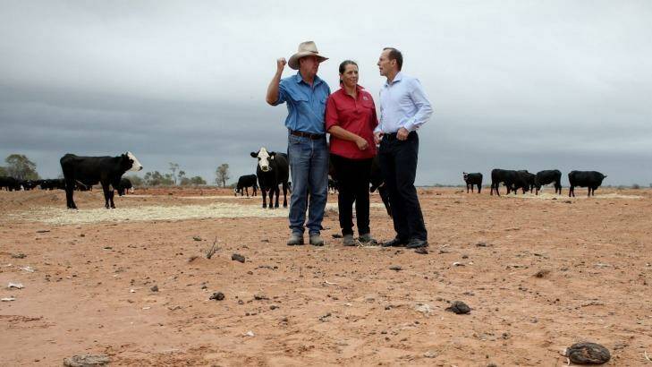 Farmers frazzled: Prime Minister Tony Abbott visits a drought-hit farm near Bourke, northern NSW, in February 2014. Photo: Andrew Meares