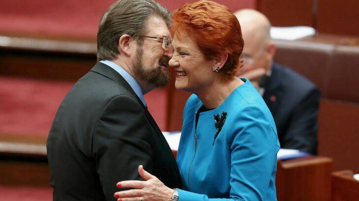 Senator Pauline Hanson is congratulated by Senator Derryn Hinch after delivering her first speech in the Senate at Parliament House in Canberra on Wednesday 14 September 2016. fedpol Photo: Alex Ellinghausen 