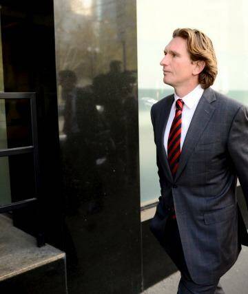 James Hird leaves the court on Friday after the ruling went against him and the club. Photo: Justin McManus