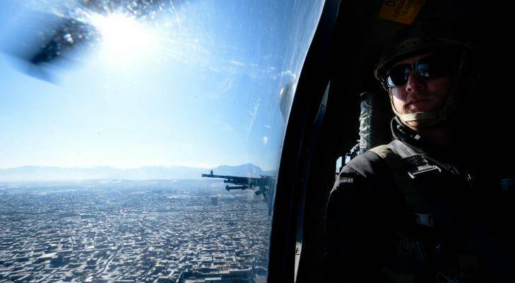 On board a Blackhawk helicopter over Kabul. Photo: Justin McManus