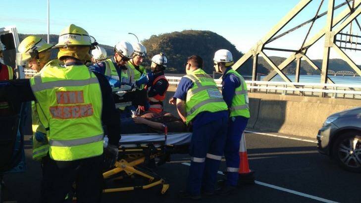 A woman, 29, who is seven months pregnant, has been airlifted to a hospital after her car was hit by a truck on the M1 Pacific Motorway. Photo: CareFlight