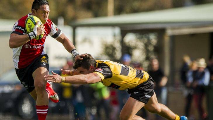 Canberra Vikings playmaker Christian Lealiifano brushes off a Perth Spirit defender. Photo: Jay Cronan