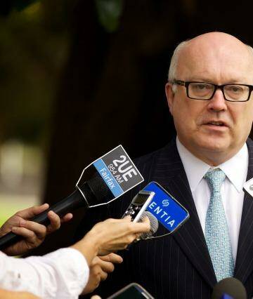 Attorney-General George Brandis has announced the royal commission into trade unions will now report back by December 31, 2015. Photo: Wolter Peters