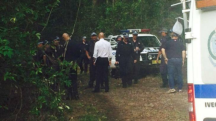 Detective Inspector Jubelin, in the white shirt, is briefed at the scene after officers found bones in the search for William Tyrell. 
 Photo: Emma Partridge