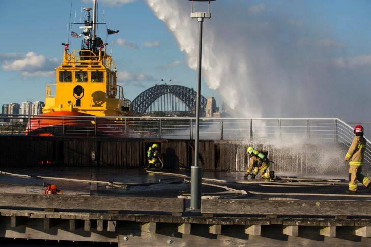 SMH. NEWS. A fire underneath the North-eastern end of the boardwalk at Darling Island, Pyrmont, is extinguished by the Port Authority and the Fire Brigade. The cause of the fire is unknown, it was called in by an off duty fireman. Friday 18th August 2017. Photo: Ryan Stuart
.