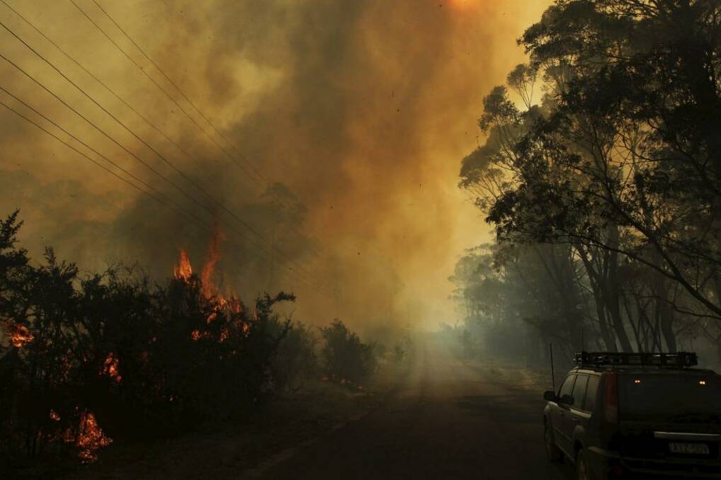 Parched properties: The risk of bushfires, like this near Lithgow last October, is elevated in a heatwave. Photo: Dean Sewell