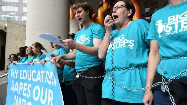 United Voice early childcare workers padlocking themselves outside Scott Morrison's offices.  Photo: Steven Siewert