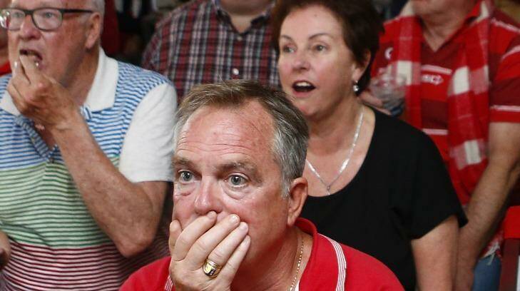 A Sydney Swans fan at the Warren View Hotel in Enmore reacts after his team lost the AFL grand final. Photo: Daniel Munoz