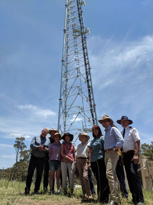 The tower plus dignitaries at its opening, including Northern Tablelands MP, Adam Marshall.