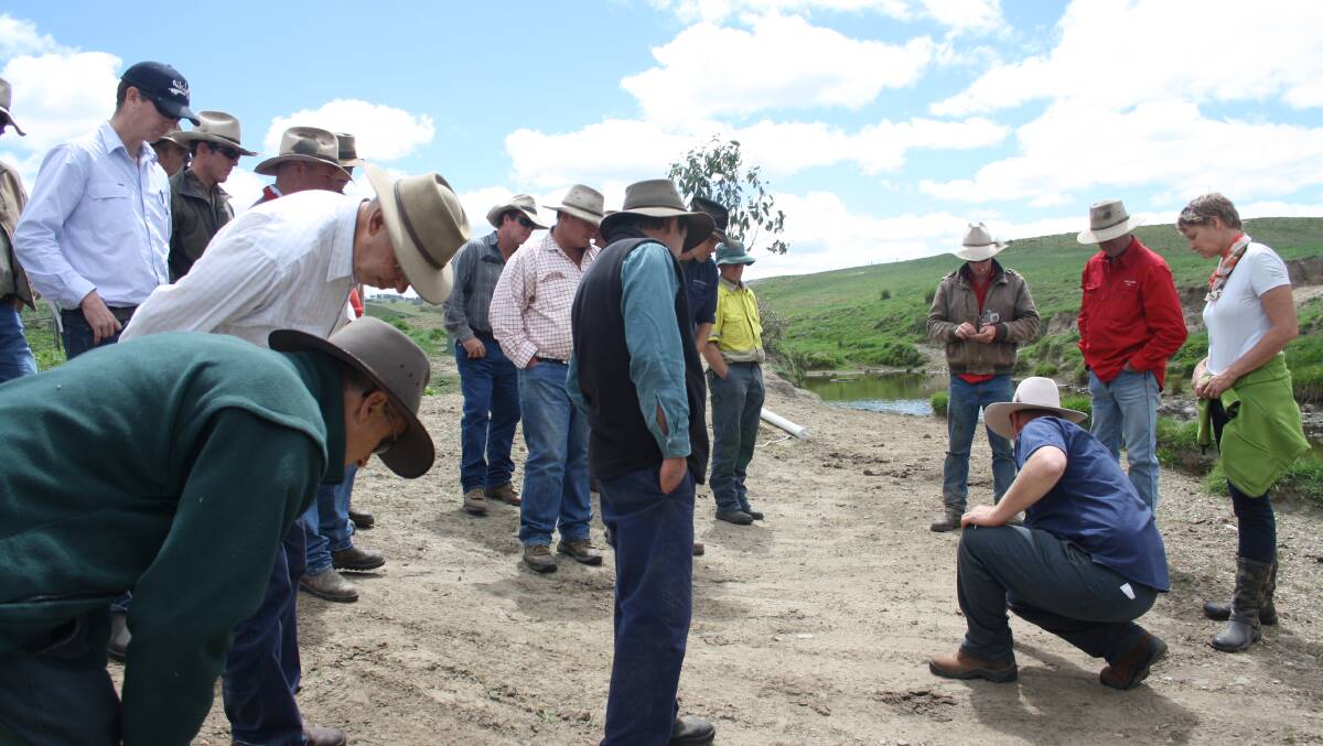 Trapper Mark Lamb shows landholders how to identify different kinds of pest animal tracks.