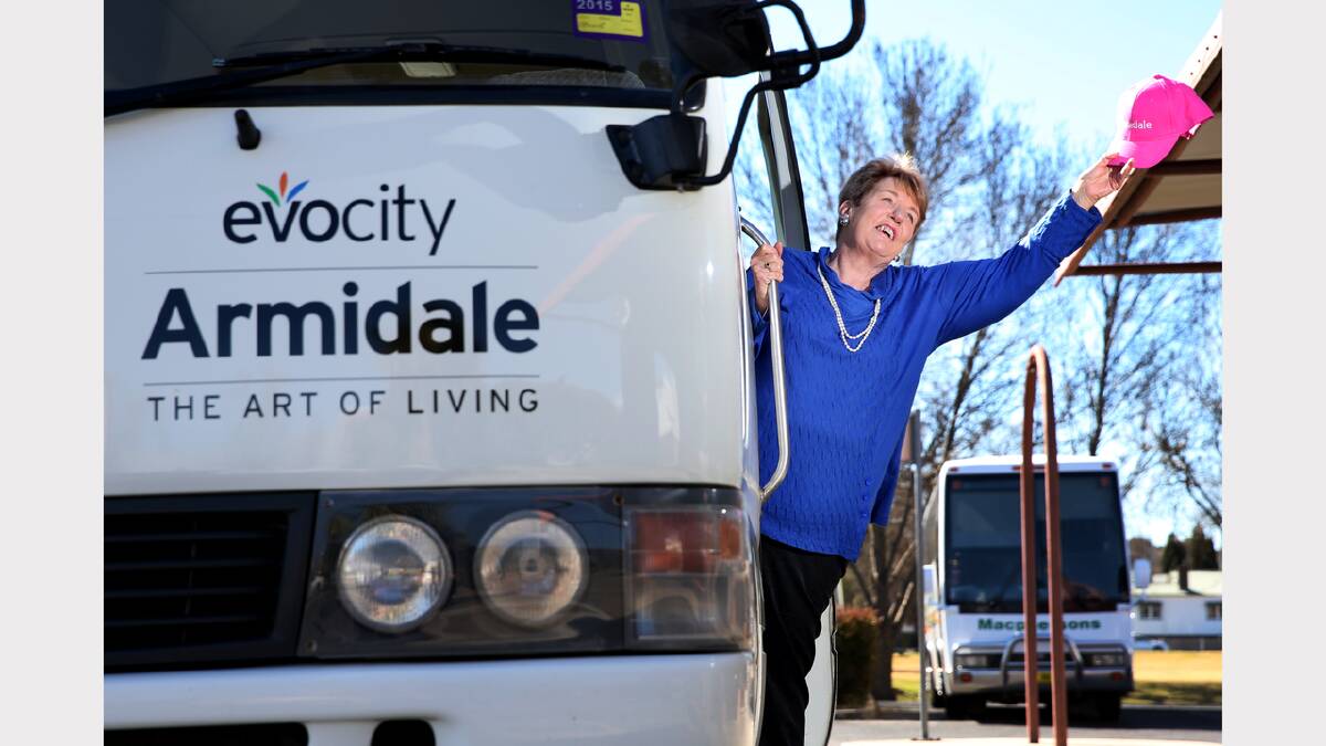 ALL ABOARD: Armidale Dumaresq deputy mayor Jenny Bailey touts for passengers on the bus to be used for the free tours.