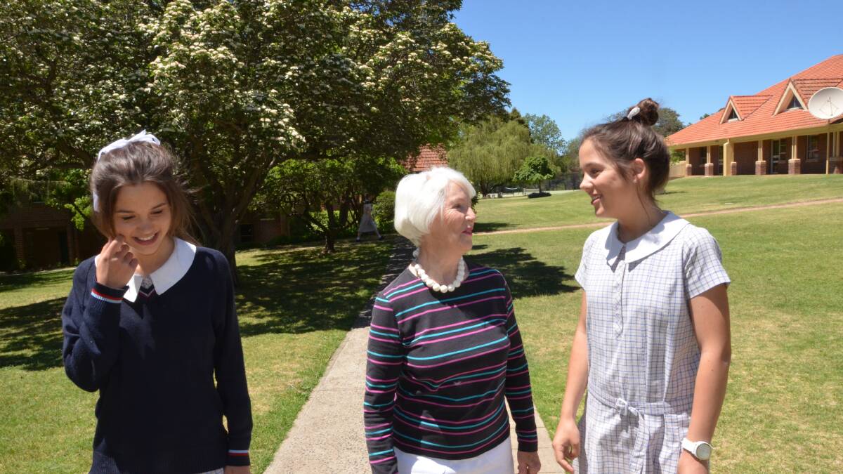 FAMILY TIES: Lily, left and Georgia Hook tour their school’s garden with their grandmother and ex-boarder Gwen Rhys-Jones.