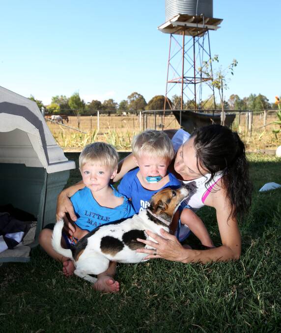 Mother Tracey Barnett with her twins Blake and Tyler, and pet dog Rosie.