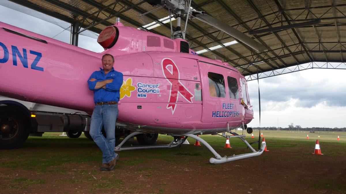 TICKLED PINK: Fleet Helicopters owner Lachie Onslow is thrilled his helicopter “Lucy” is raising money for Cancer Council NSW.