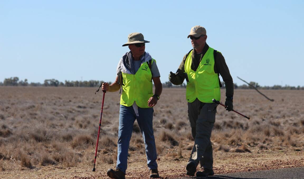 STEPPING FOR SERVICEMEN: Wandering Warriors’ Audie Moldre and Mick Donaldson during last year’s mega-challenge.