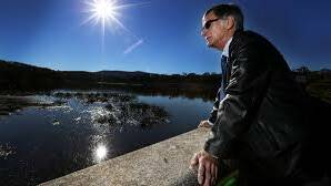 Armidale Dumaresq councillor Colin Gadd inspects Dumaresq Dam earlier this year.