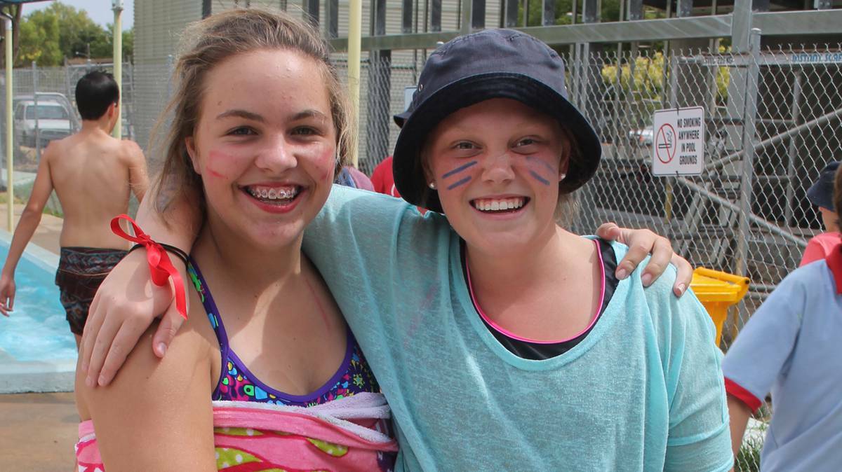 COOTAMUNDRA HERALD: Enjoying themselves at the Sacred Heart Central School carnival were Laura Miller and Ellie Mullins.