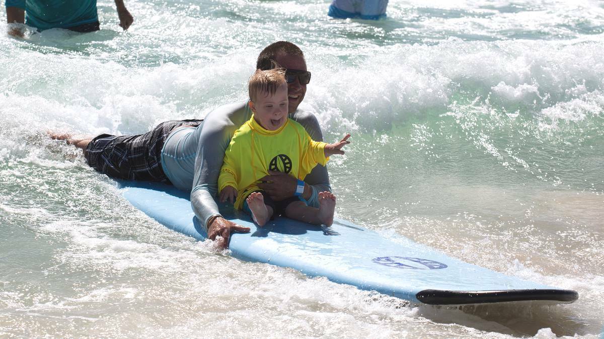 BUSSELTON-DUNSBOROUGH MAIL: Christian and Caleb Negus enjoying themselves at the disabled surfers session at Bunker Bay. Photo: Ben Jasinski/Busselton-Dunsborough Mail.