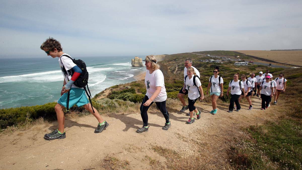 TWELVE APOSTLES: Billy Heard, 12, leads the way for parents Murray and Nicol Heard and sister Haylee, 13, walking from the Twelve Apostles to Apollo Bay to raise awareness about organ donation. Picture: DAMIAN WHITE