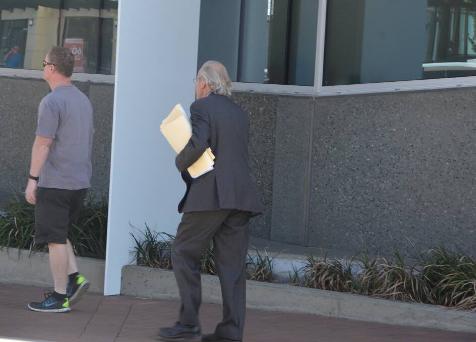 SEX ARREST: Agent solicitor for the accused woman, Clive Sharkey, pictured arriving at Armidale Local Court on Wednesday, ahead of the hearing to suppress details of the case against the suspended staff member. Photo: Armidale Express