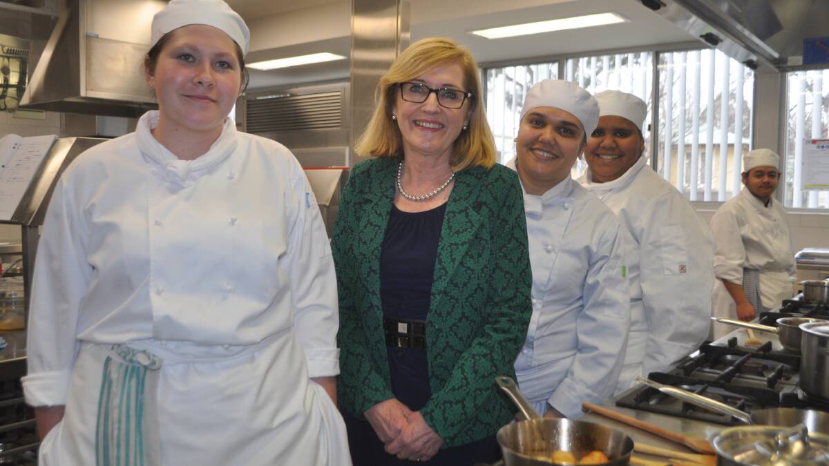 COOK UP: Kitchen Operations Certificate II students Jaymie Batterbury, Veronica Smith and Laura Vale with TAFE NSW managing  director Pam Christie.